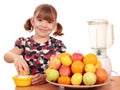 Happy little girl make juice Royalty Free Stock Photo