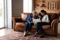 Happy little girl with mother and mature grandmother using laptop Royalty Free Stock Photo