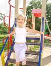 Happy little girl on outdoor playground equipment Royalty Free Stock Photo