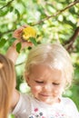 Happy little girl picking apple from tree Royalty Free Stock Photo