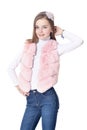 Happy little girl in pink fur vest posing Royalty Free Stock Photo
