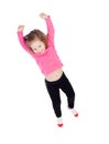 Happy little girl in pink jumping Royalty Free Stock Photo