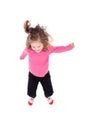 Happy little girl in pink jumping Royalty Free Stock Photo