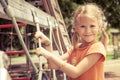 Happy little girl on the playground Royalty Free Stock Photo