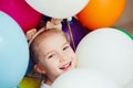 Happy little girl playing with balloons