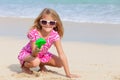 Happy little girl playing on the beach Royalty Free Stock Photo