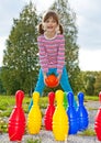 Happy little girl playing bowling Royalty Free Stock Photo
