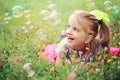 Happy little girl playing with bubbles Royalty Free Stock Photo