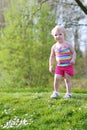 Happy little girl playing outdoors Royalty Free Stock Photo