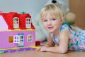 Happy little girl playing with plastic blocks Royalty Free Stock Photo