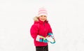 Happy little girl playing with snow in winter Royalty Free Stock Photo