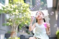 Happy little girl playing soap bubbles in garden Royalty Free Stock Photo