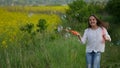 Happy little girl playing among soap bubbles on green meadow in summer Royalty Free Stock Photo