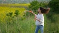 Happy little girl playing among soap bubbles on green meadow in summer Royalty Free Stock Photo