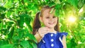 Happy little girl playing in summer apple tree garden Royalty Free Stock Photo