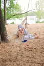 Happy Little Girl Playing on Swing on Beach by Lake Royalty Free Stock Photo