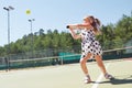 Happy little girl playing tennis Royalty Free Stock Photo