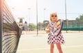 Happy little girl playing tennis Royalty Free Stock Photo