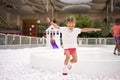 Happy little girl playing white plastic balls pool in amusement park. playground for kids Royalty Free Stock Photo