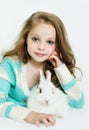 Happy little girl with rabbit