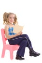 Happy little girl reading a book Royalty Free Stock Photo