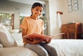 Happy little girl, reading book and bed with smile for story time, education or learning in comfort at home. Portrait of Royalty Free Stock Photo