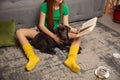 Happy little girl reading book with beloved dog. Lifestyle concept Royalty Free Stock Photo