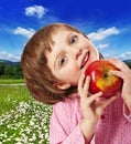 Happy little girl with red apple Royalty Free Stock Photo