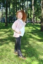 Happy little girl with red hair in diadem poses Royalty Free Stock Photo