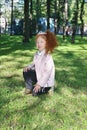 Happy little girl with red hair in diadem Royalty Free Stock Photo