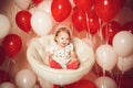 Happy little girl with red and white balloons Royalty Free Stock Photo