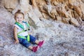 Happy little girl in rock climbing safety harness Royalty Free Stock Photo