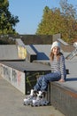 Happy little girl with rollerskates