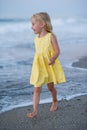 Happy little girl running and jumping at beach Royalty Free Stock Photo