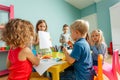 Happy little girl showing her drawing to the camera Royalty Free Stock Photo