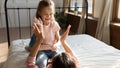 Happy little girl playing patty cake with mom. Royalty Free Stock Photo