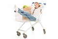 happy little girl sitting in shopping cart and showing thumb up Royalty Free Stock Photo