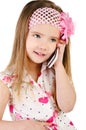 Happy little girl speaking by cell phone isolated Royalty Free Stock Photo