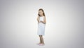 Happy little girl speaking by cell phone on white background Royalty Free Stock Photo