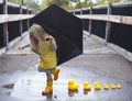 Playful girl with duckies Royalty Free Stock Photo