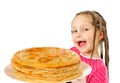 Happy little girl with tasty pancakes