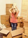 Happy little girl with toy. Cardboard boxes - moving to new house. happy child cardboard box. Moving concept. new Royalty Free Stock Photo