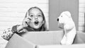 happy little girl with toy. purchase of new habitation. Cardboard boxes - moving to new house. happy child cardboard box Royalty Free Stock Photo