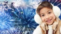 Happy little girl wearing earmuffs over firework Royalty Free Stock Photo