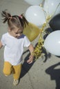 Happy little girl running with balloons Royalty Free Stock Photo