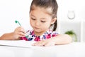 Happy little girl writing in notebook Royalty Free Stock Photo