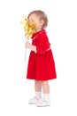 Happy little girl with yellow flower Royalty Free Stock Photo