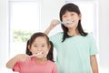 Happy little girls brushing her teeth Royalty Free Stock Photo