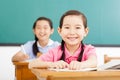 Happy little girls in the classroom