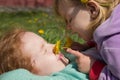 Happy little girls with dandelion